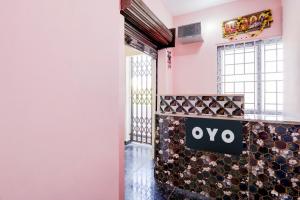 a lobby with a sign that reads omega at Hotel O KSR GRAND in Maula Ali