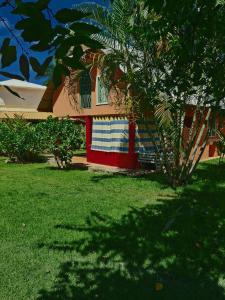 a house with a flag painted on the side of it at Labellaventura in Las Galeras