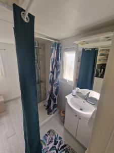 a bathroom with a sink and a toilet and a mirror at Chalet de la Source in Casanova +29 photos