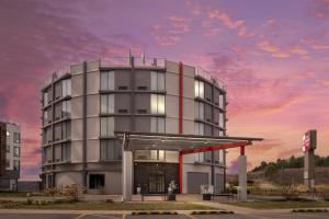 a rendering of a building with a gas station at Best Western Plus Wausau Tower Inn in Wausau