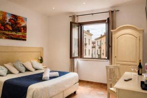 a bedroom with a bed and a window at Central Dorgali Guest House in Dorgali