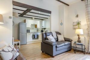 a living room with a couch and a kitchen at 2 Bed in Shanklin oc-c36037 in Shanklin