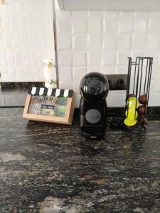 a blender sitting on a counter next to a box at Apartamentos Dali 1 in Guadix