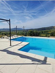 a large swimming pool with blue water at Solar do Prazo-Serra & Charme in Gonçalo
