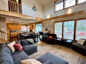 a large living room with couches and a dining room at Cape Kiwanda Hideaway in Pacific City