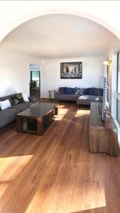 a living room with a couch and a coffee table at Spacious & Sun-Filled Highlands Retreat in Moss Vale