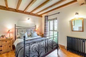 a bedroom with a black bed and a window at 2 Bed in Dorchester oc-dc075 in Charminster