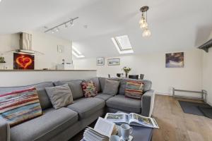 a living room with a couch and a table at 2 Bed in Beaminster oc-63047 in Broadwindsor