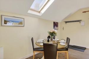 a dining room with a table and chairs at 2 Bed in Beaminster oc-63047 in Broadwindsor +19 photos