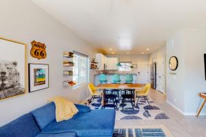 a living room with a blue couch and a table at The Pine House in Flagstaff