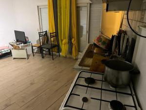 a kitchen with a stove top oven in a room at Cocon de Audrey in Graulhet