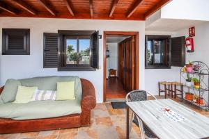 a living room with a couch and a table at Finca Villanueva in Mala
