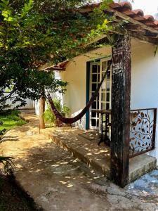 a house with a rope leading to a door at Cantinho Almeida in Tiradentes