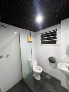 a bathroom with a toilet and a sink at Arcos Da Lapa Hostel in Rio de Janeiro