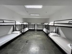 a room with several bunk beds in it at Arcos Da Lapa Hostel in Rio de Janeiro