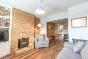 a living room with a couch and a fireplace at 1 Bed Cottage Great Ayton - TOP Cottage in Great Ayton