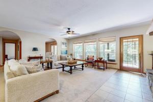 a living room with a couch and a table at Sprawling Eufaula Lake Sanctuary w/ Dock! in Texanna