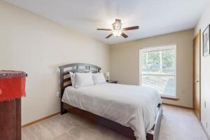 a bedroom with a bed and a ceiling fan at Sprawling Eufaula Lake Sanctuary w/ Dock! in Texanna