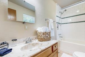 a bathroom with a sink and a toilet and a tub at Sprawling Eufaula Lake Sanctuary w/ Dock! in Texanna +16 photos