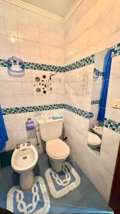 a bathroom with a toilet and a sink at Villa Terrazos in Terrazos +45 photos