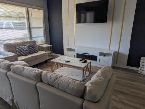 a living room with a couch and a table at Fresh start small breakfast cook and serve your self in Lubbock