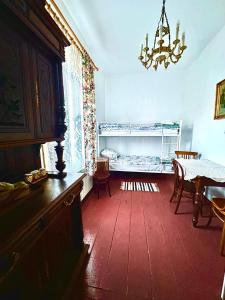 a room with a bed and a table and a dining room at Dom pod Platanami in Bondyrz
