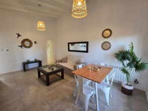 a living room with a table and a couch at Casita Cómoda y Acogedora in Trenque Lauquen