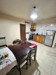 a kitchen with a dining room table and a kitchen with at Casa Bella Vista in Pocito