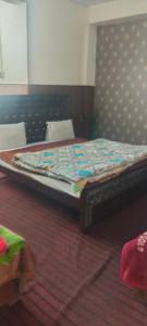 a large bed in a room with a mattress at Hamala Inn Hotel in Abbottabad