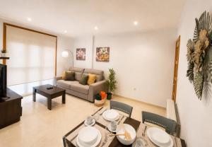 a living room with a couch and a table at RELAX VIVEIRO in Viveiro +17 photos