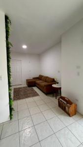 a living room with a couch and a table at Casa Costa Hermosa in Tijuana