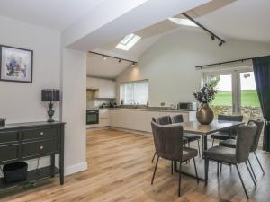 a kitchen and dining room with a table and chairs at Cross Winds in Lancaster