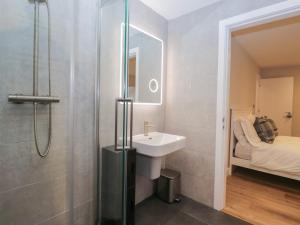 a bathroom with a sink and a shower at Cross Winds in Lancaster