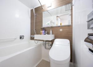a bathroom with a white toilet and a sink at Hotel St Palace Kurayoshi in Kurayoshi +31 photos