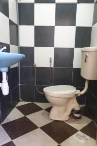 a bathroom with a toilet and a sink at perfect class hotel in Kuala Lumpur