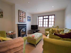 a living room with couches and a fire place at 3 Bed in York oc-hh015 in Tockwith
