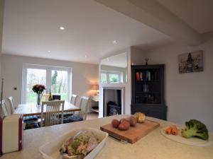 a kitchen with a table with fruits and vegetables on it at 3 Bed in York oc-hh015 in Tockwith +8 photos