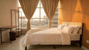 a bedroom with a bed and a large window at Suasana JB Central by TPL in Johor Bahru +16 photos