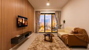 a living room with a couch and a large window at Suasana JB Central by TPL in Johor Bahru