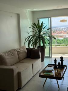 a living room with a couch and a table at Studio 404 Premium Flat - Juazeiro do Norte - Cariri in Juazeiro do Norte