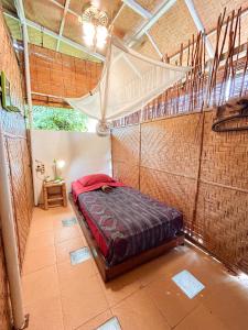 a bedroom with a bed in a brick wall at Serenity Eco Guesthouse and Yoga- CHSE certified in Canggu +69 photos
