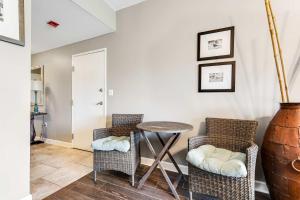 a dining room with a table and two chairs at Resort Studio with Nature Preserve Views in Destin +16 photos