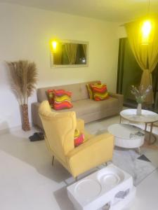 a living room with a couch and a chair at Dominican paradise in Punta Cana