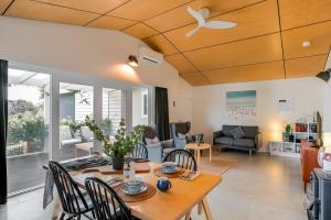 a living room with a table and chairs at Stablebase in Albany