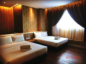 Letto o letti in una camera di D Elegance Hotel Nusajaya