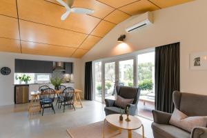 a living room with a couch and a table at Stablebase in Albany