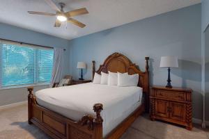 a bedroom with a bed and a ceiling fan at TOPS'L Summit 210 in Destin