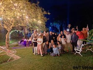 a group of people posing for a picture in a yard at Cabañas rurales Aldea de Cabal - Naturaleza y Sabor cerca a Termales Reservamos tu entrada a termales Santa Rosa in Santa Rosa de Cabal