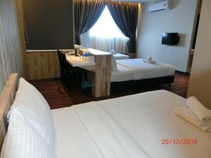 Letto o letti in una camera di D Elegance Hotel Nusajaya