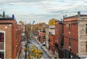 a view of a city street with brick buildings at Comfort Residence in Montreal